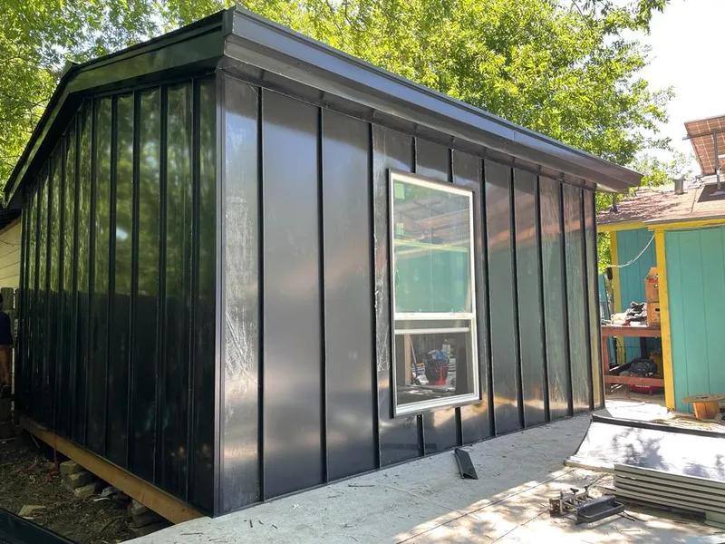 Black standing seam metal wall panels for Metal Roof Installation in Ham Lake