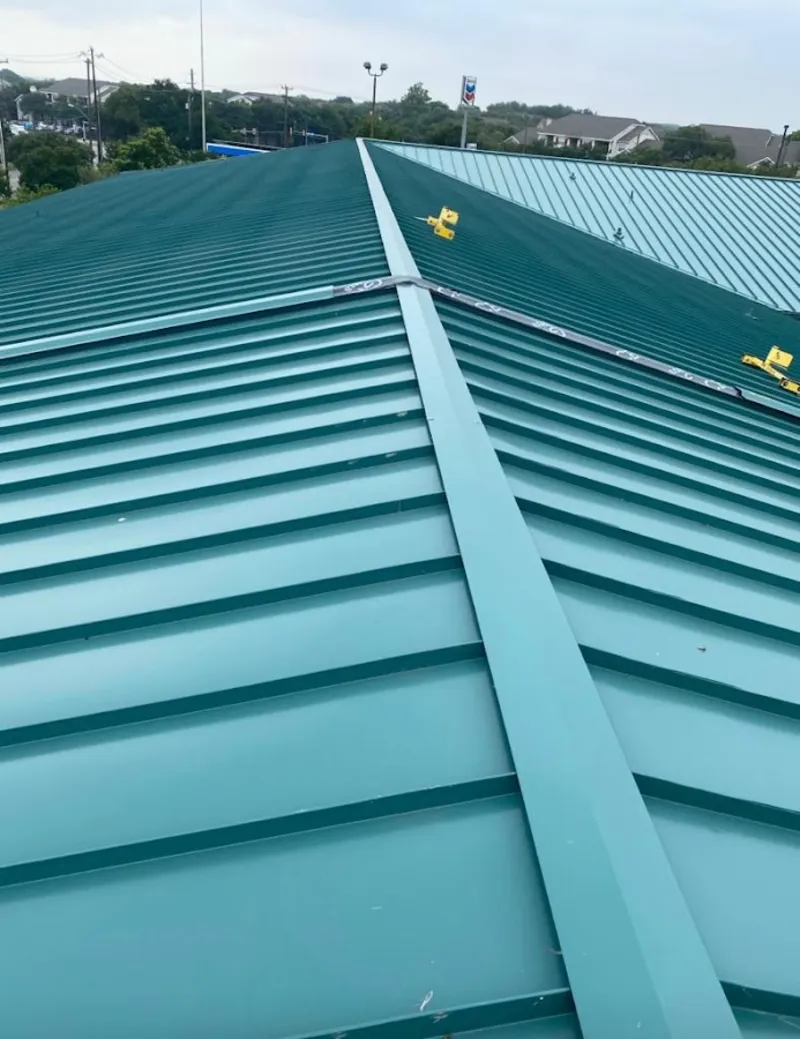 Green commercial metal roof ridge and valley for Metal Roof Repair in Ham Lake